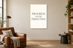 Progress Over Perfection in a reading corner — interior mockup with the complete original artwork